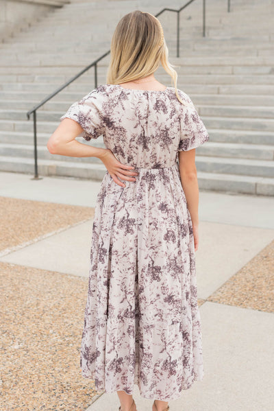 Back view of the cream floral smocked dress