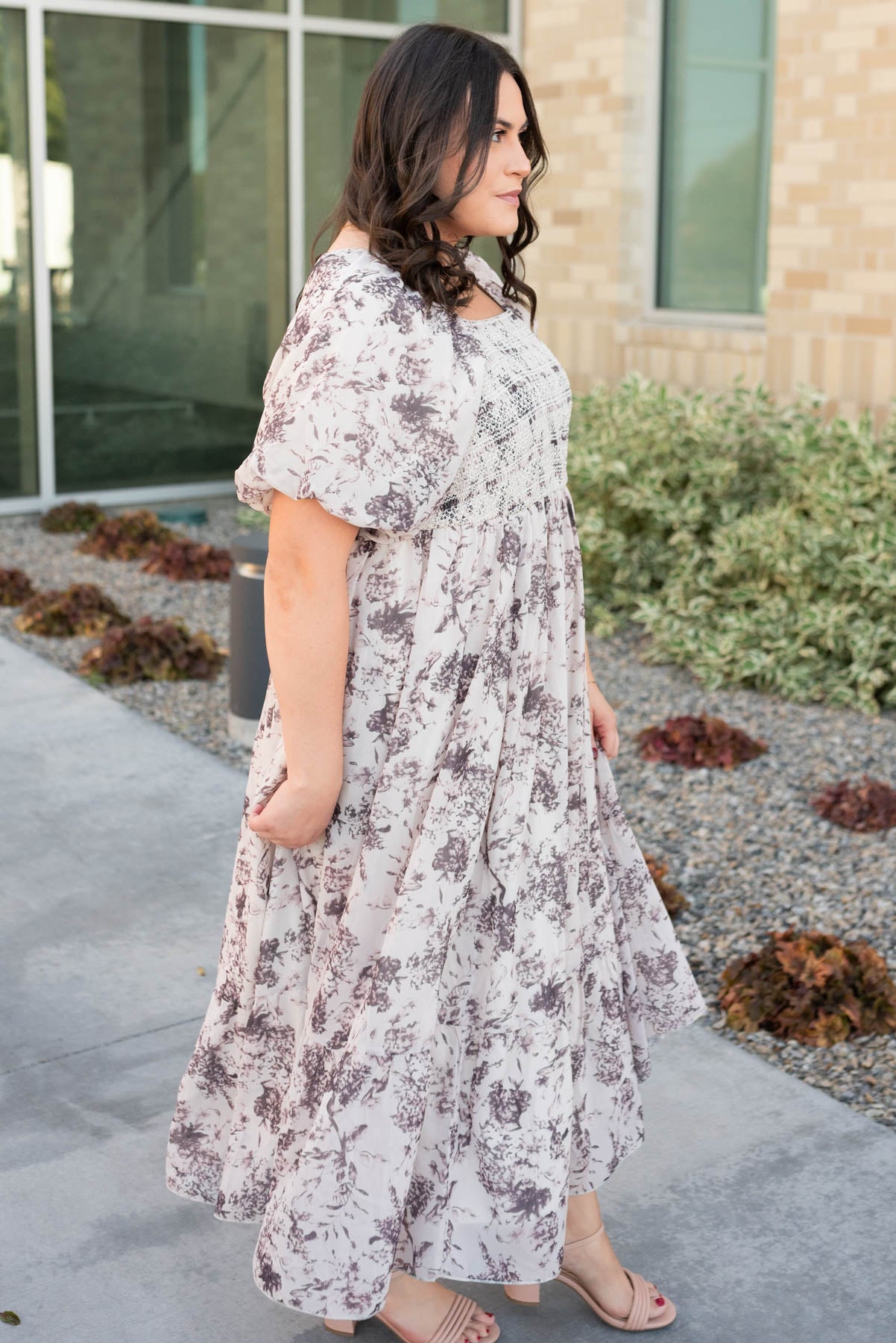 Side view of the cream floral smocked dress in plus size