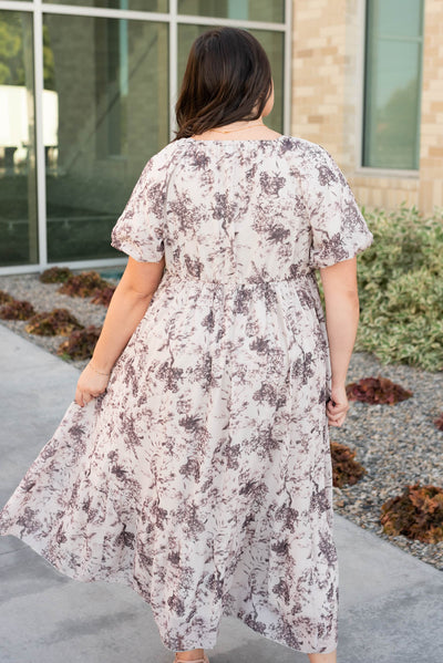 Back view of the cream flroal smocked dress in plus size