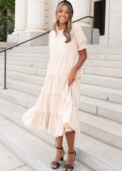 Short sleeve tiered cream dress