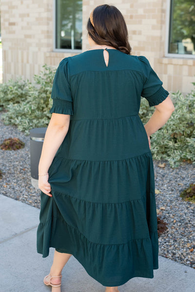 Back view of the plus size tiered dark green dress