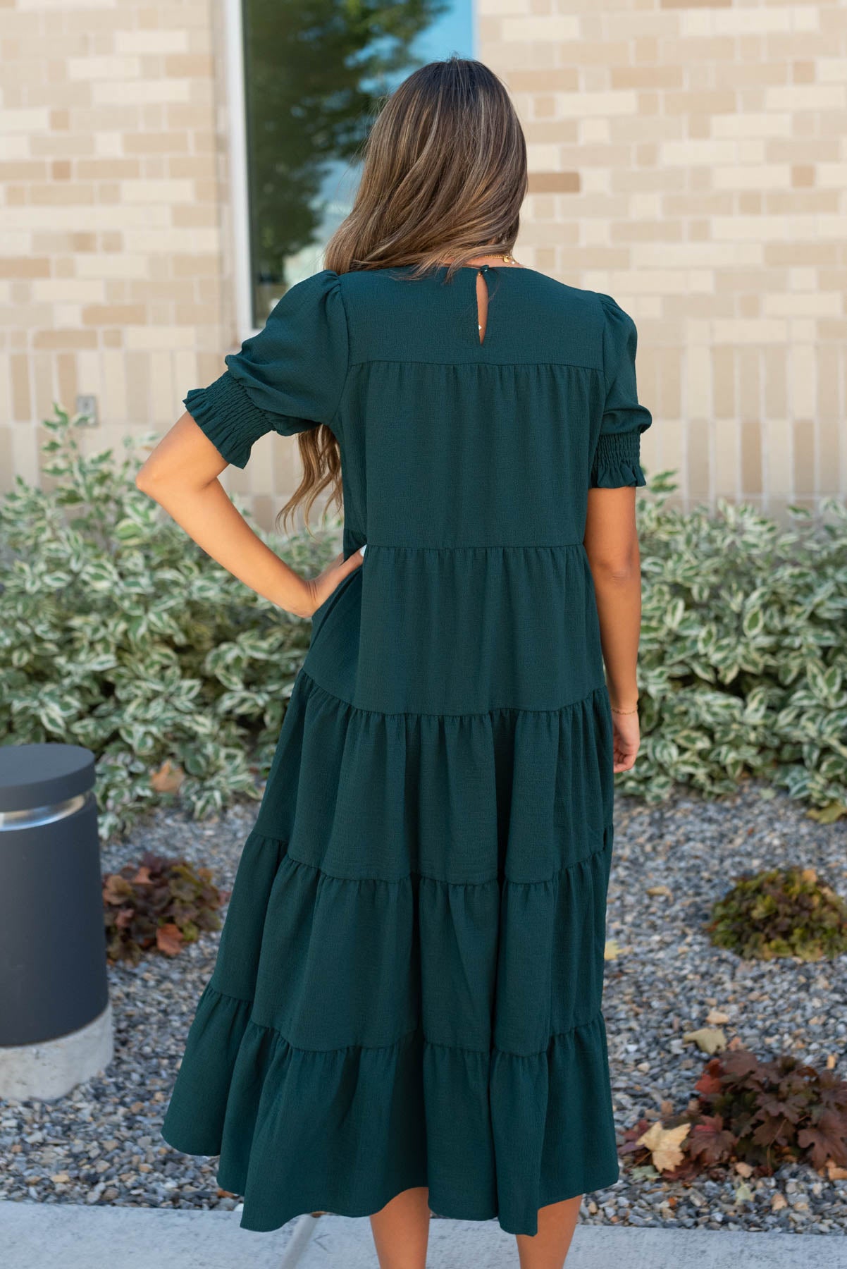 Back view of the tiered dark green dress