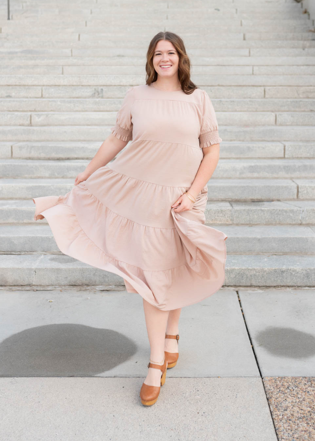 Front view of the tiered dusty blush dress in plus size