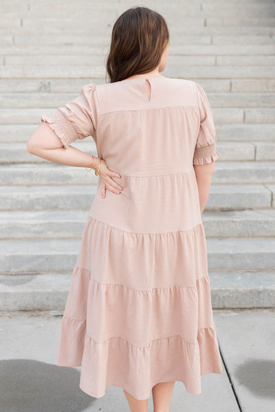 Back view of the Plus size tiered dusty blush dress