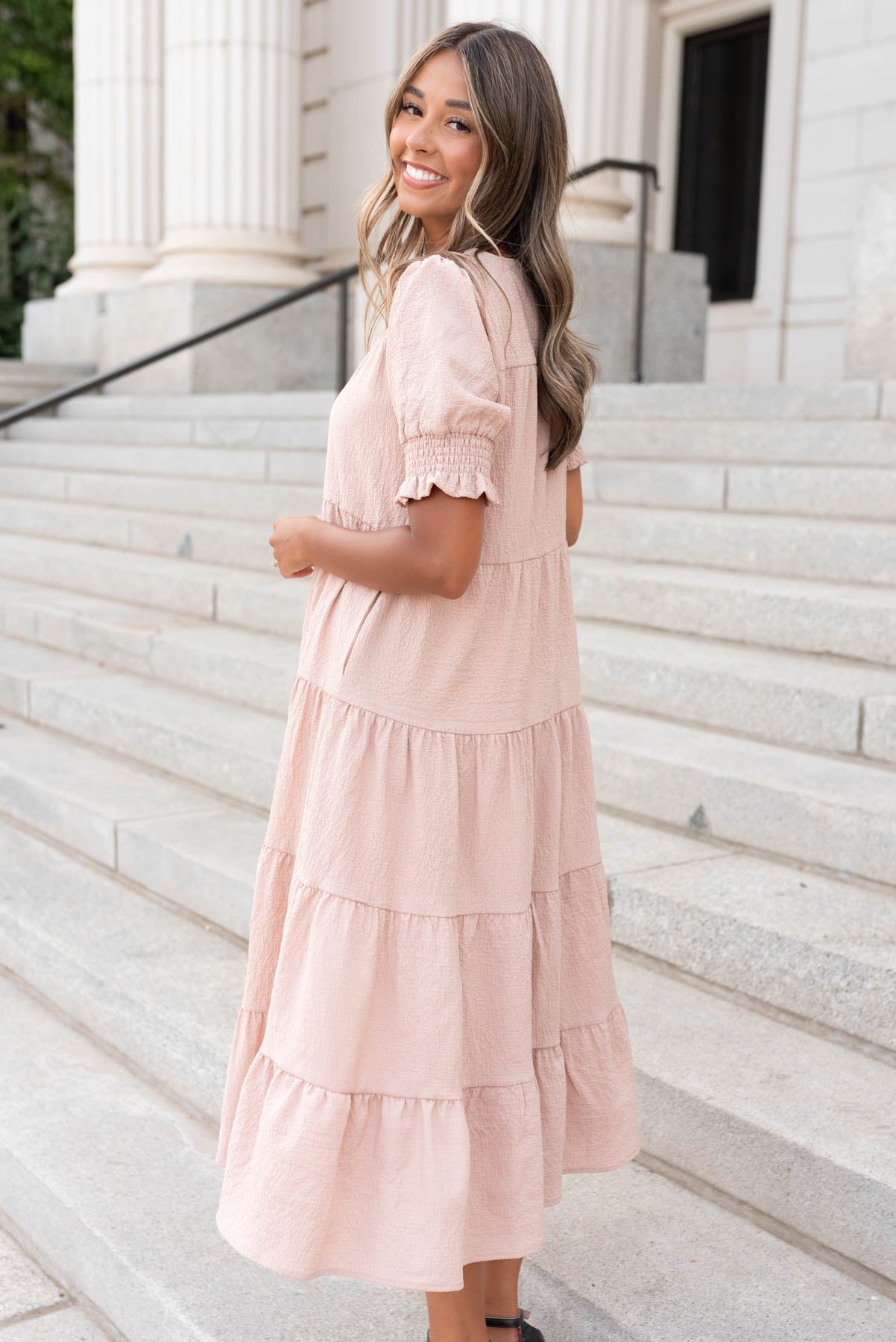 Side view of the tiered taupe dress