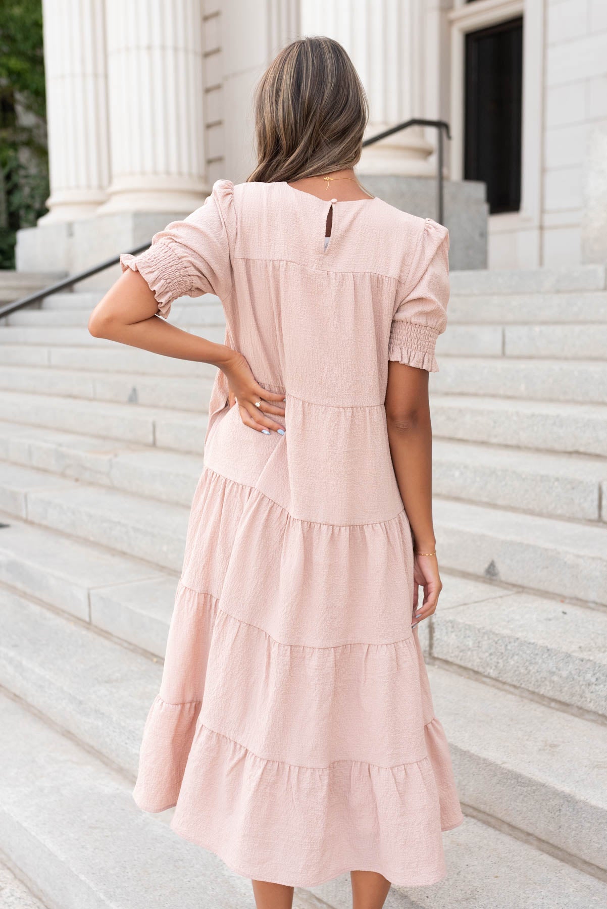 Back view of the tiered taupe dress