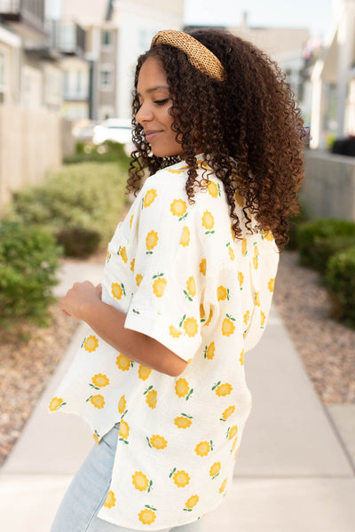 Side view of the viory gold floral top