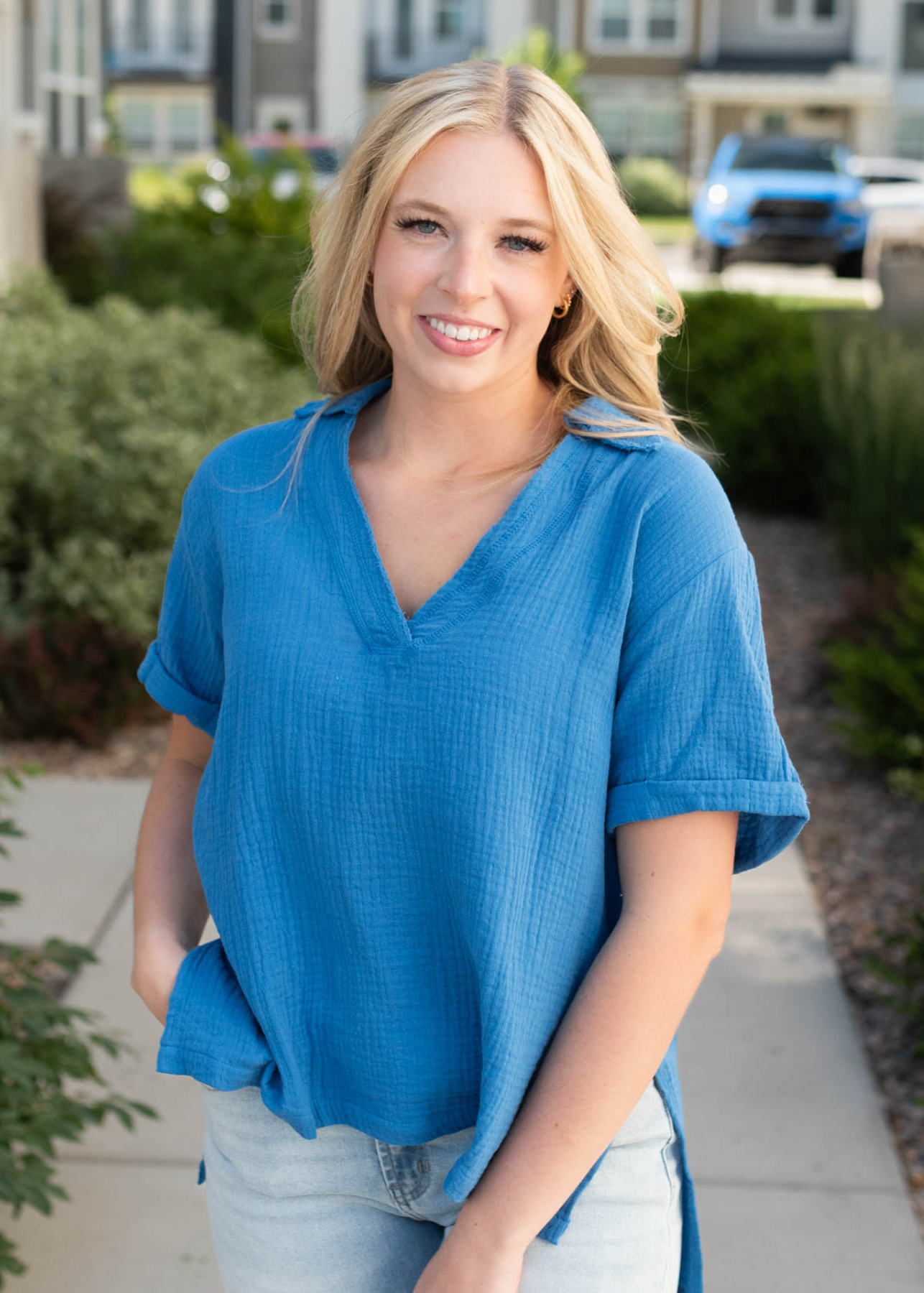 Blue collared top with a high low hem