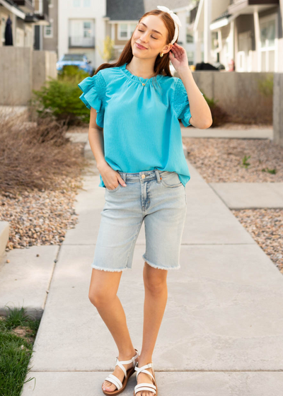 Turquoise ruffle blouse