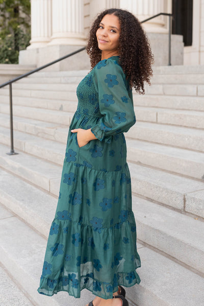 Side view of the dark green floral dress