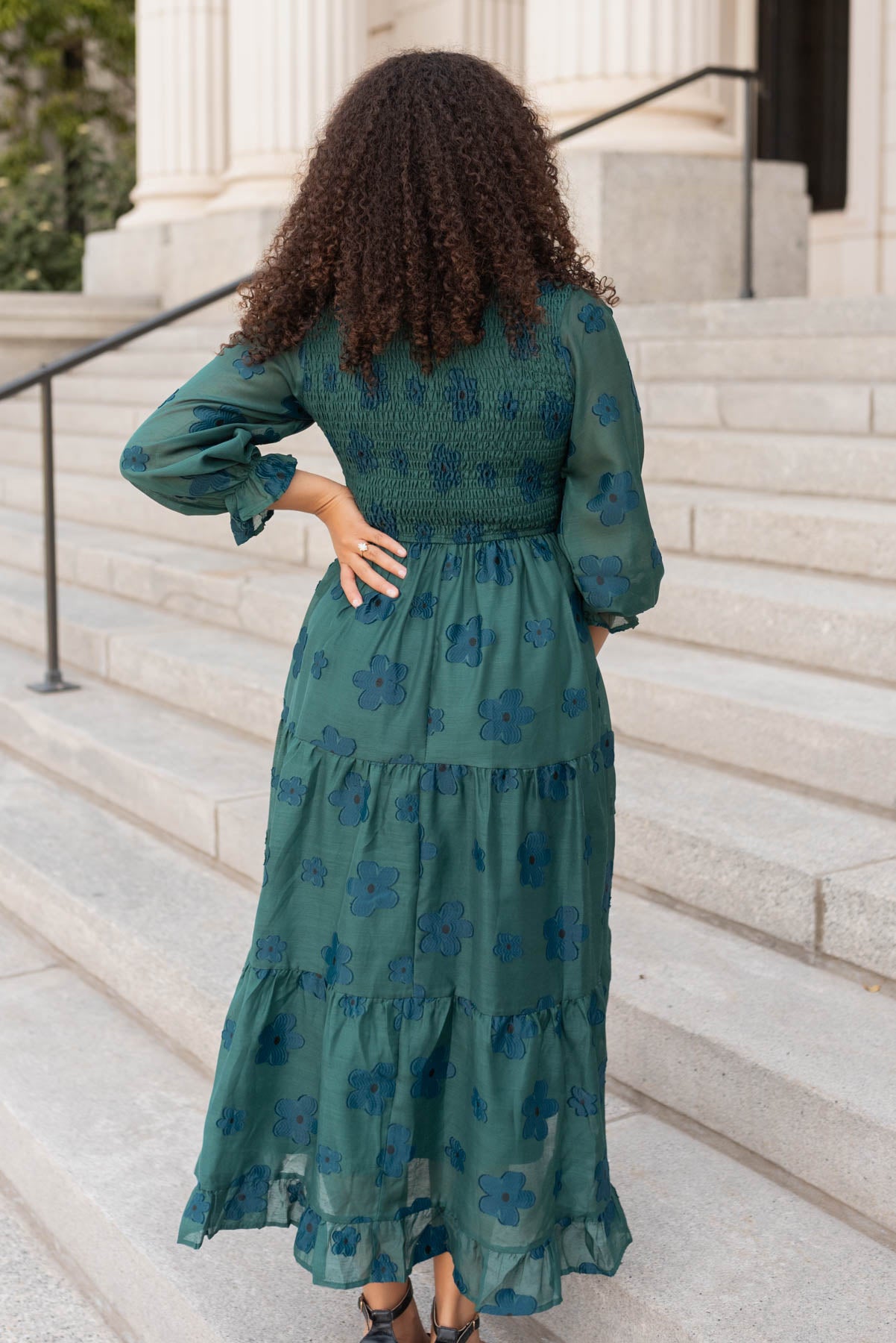 Back view of the dark green floral dress