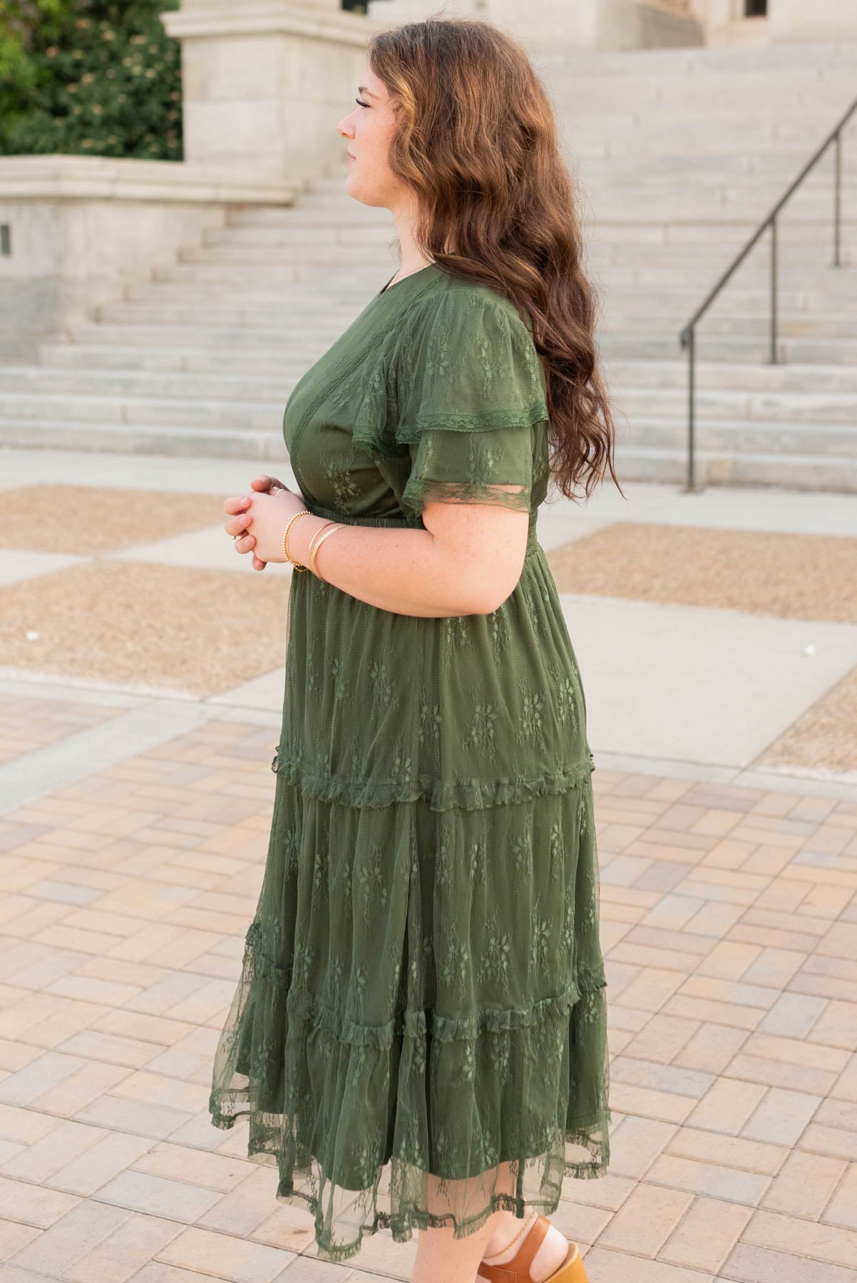 Side view of the plus size dark green floral lace dress