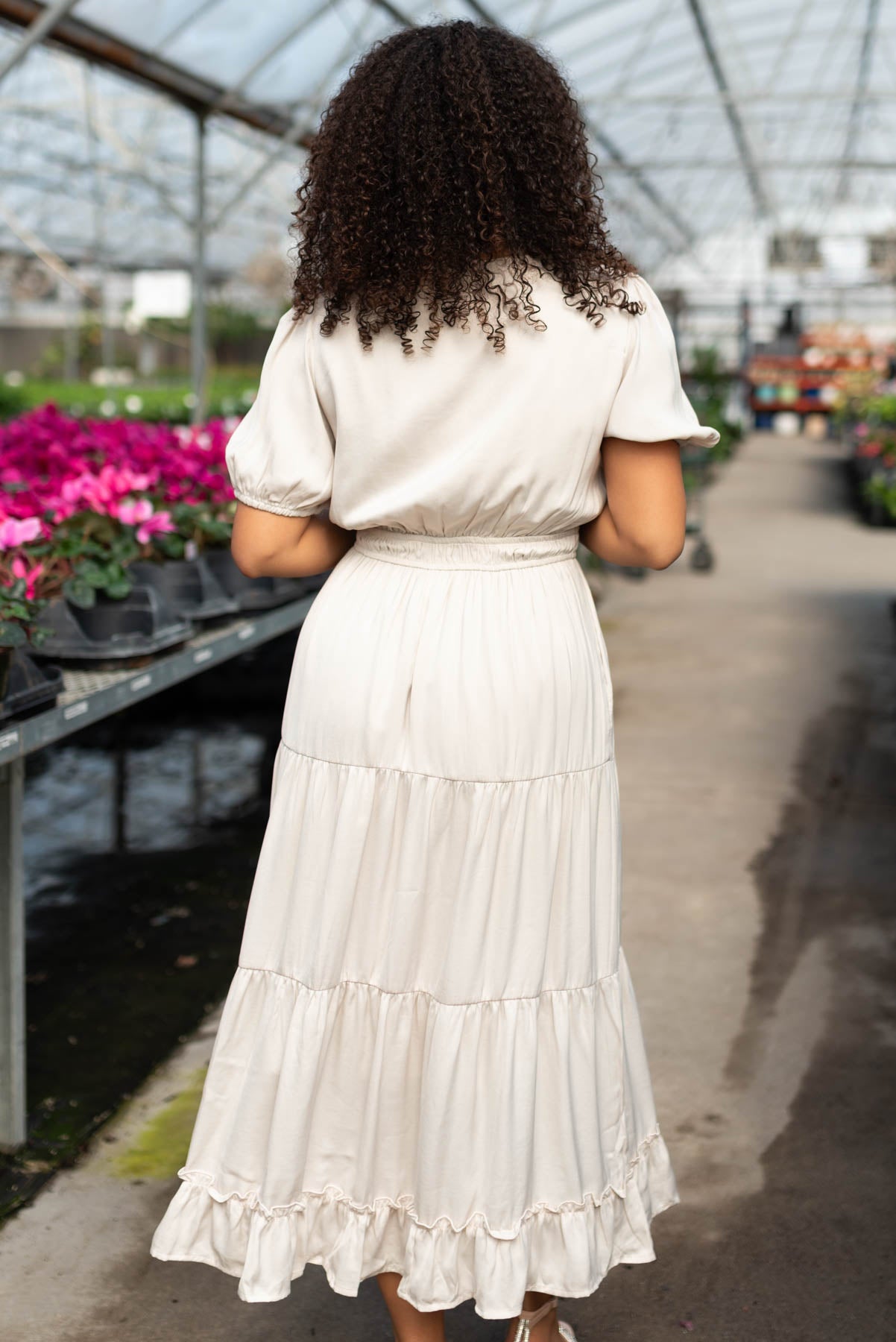 Back view of the ivory satin tiered dress