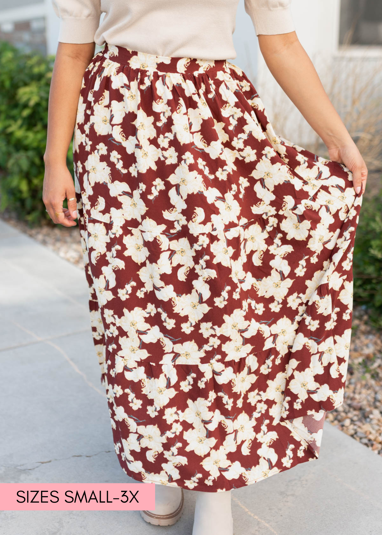 Close up of the fabirc of the burundy multi floral skirt