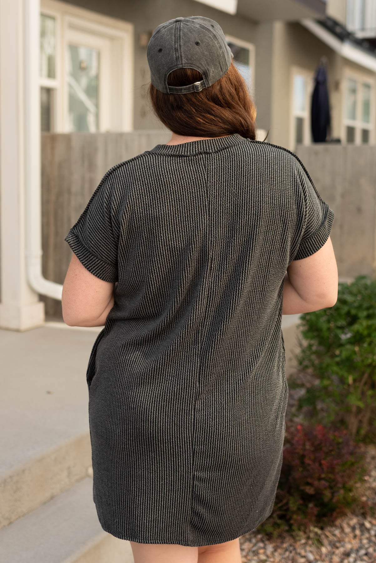 Back view of the plus size charcoal ribbed t-shirt dress