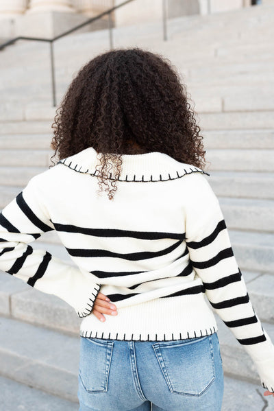 Back view of the ivory black stripe sweater