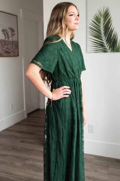 Side view of the hunter green lace floral dress