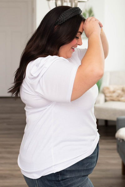 Side view of a plus size white v neck puff sleeve top