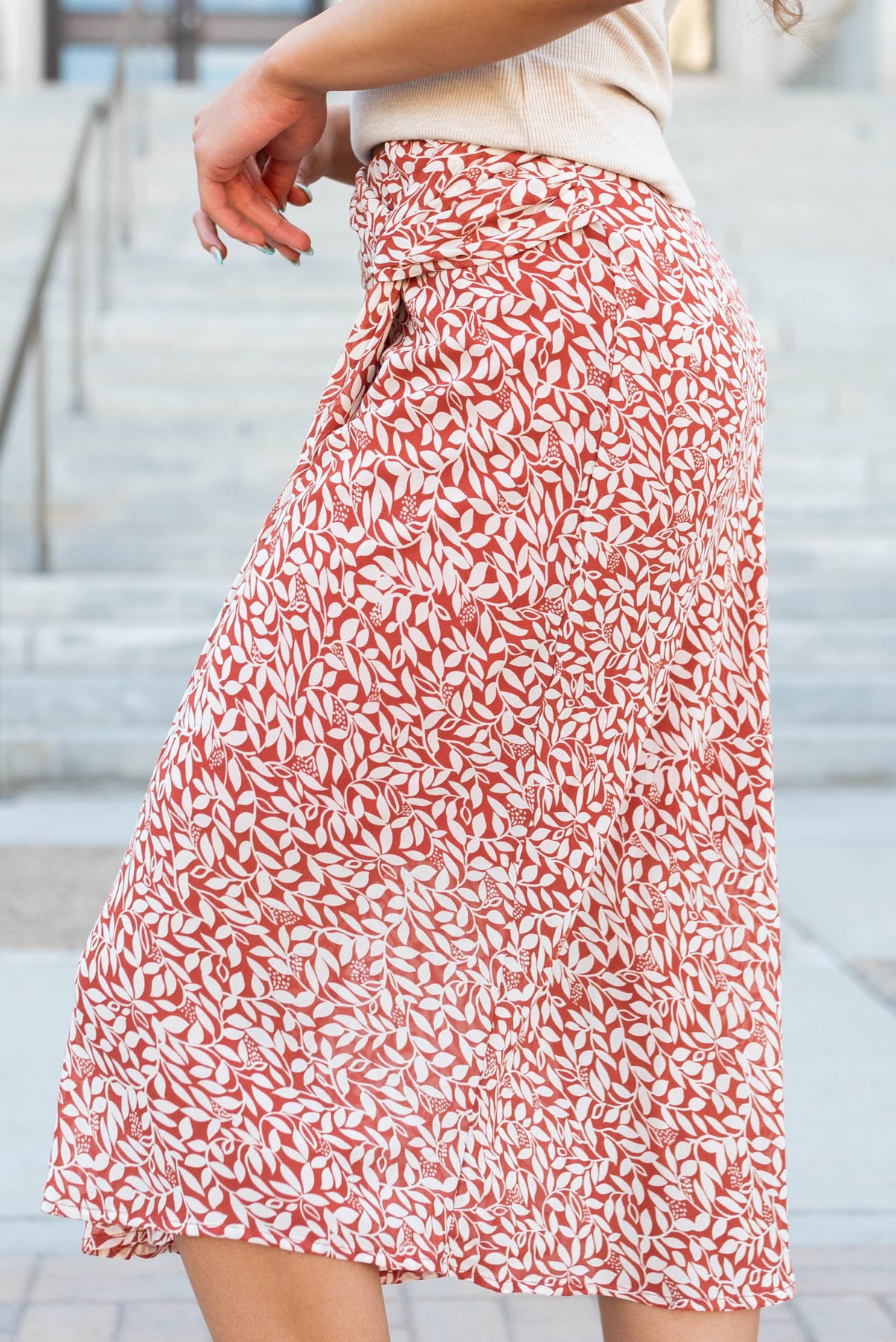 Side view of the rust floral knot skirt