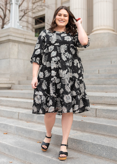 Plus size black floral dress with tiered skirt