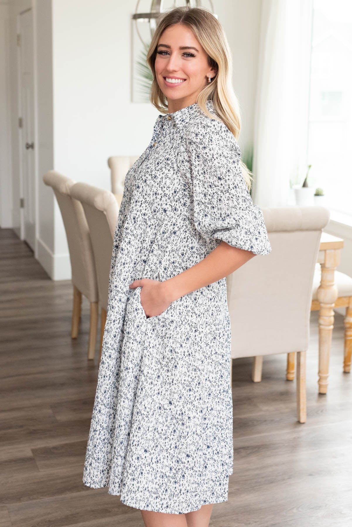 Side view of the blue floral button dress with pockets