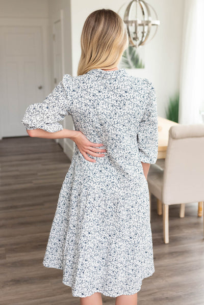 Back view of the blue floral button dress