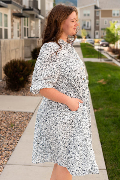 Side view of the plus size blue floral button dress