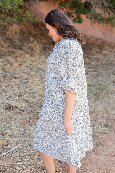 Side view of the plus size blue floral button dress