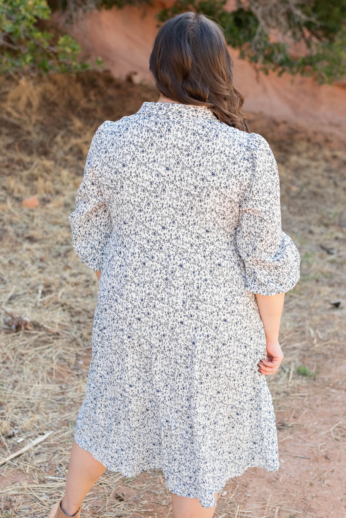 Back view of the blue floral button dress in plus size