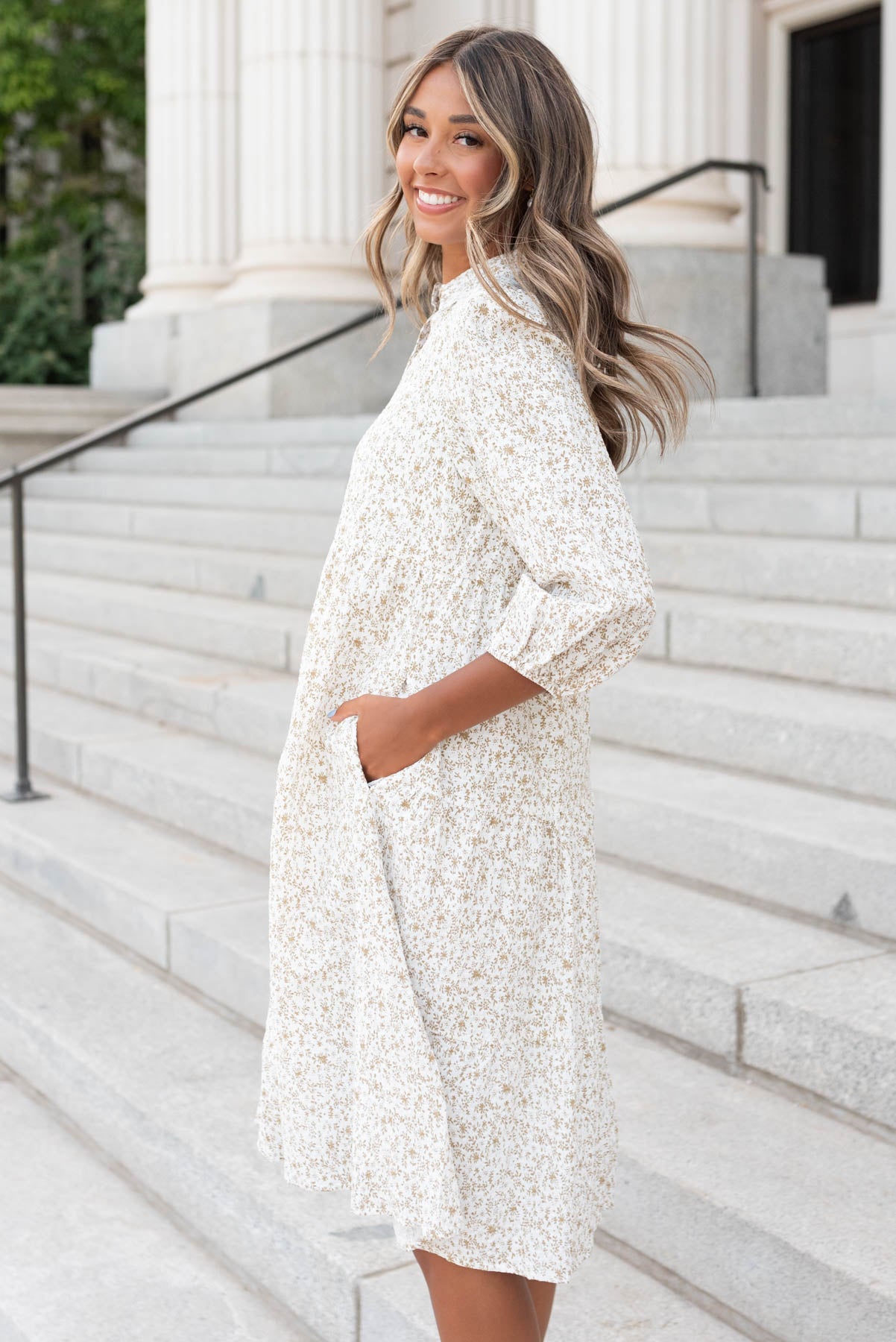 Side view of the taupe floral button dress with pockets