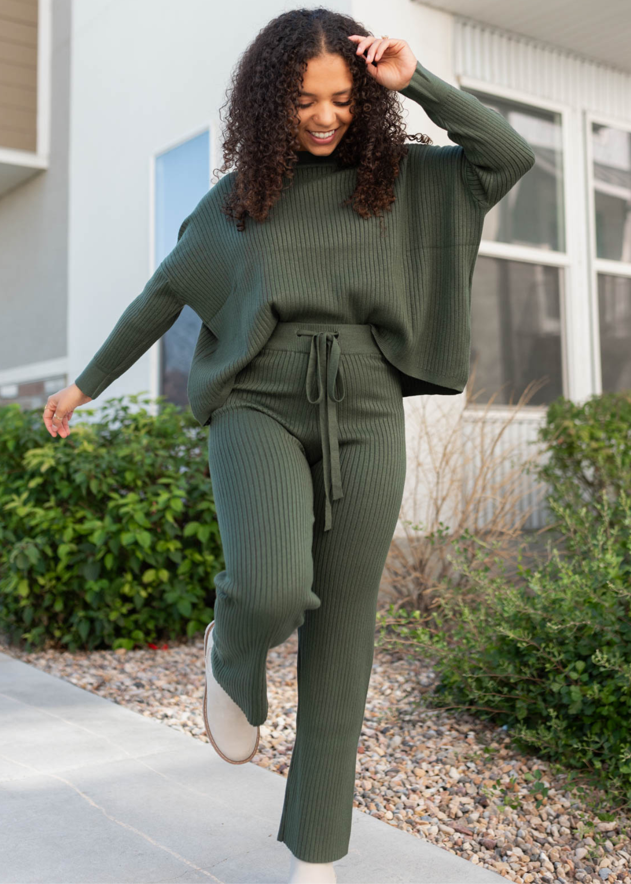 Dark green sweater with drop sleeves