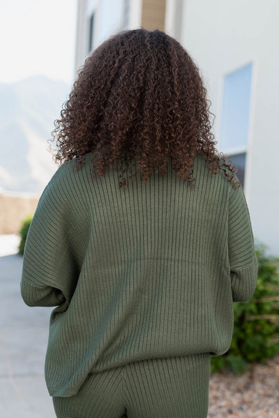 Back view of the dark green sweater