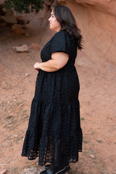 Side view of the plus size black floral lace dress