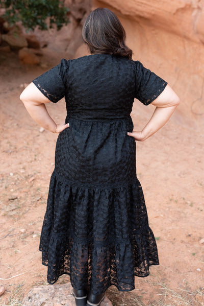 Back view of the plus size black floral lace dress