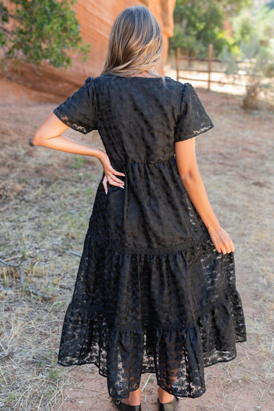 Back view of he black floral lace dress