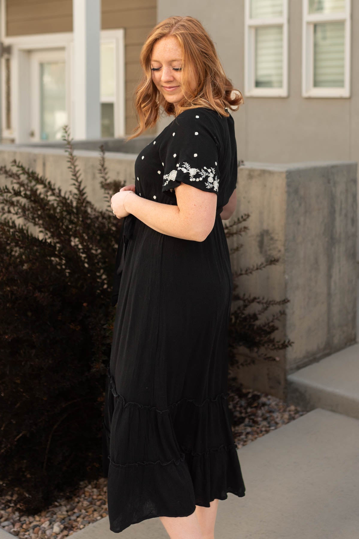 Side view of a black floral dress