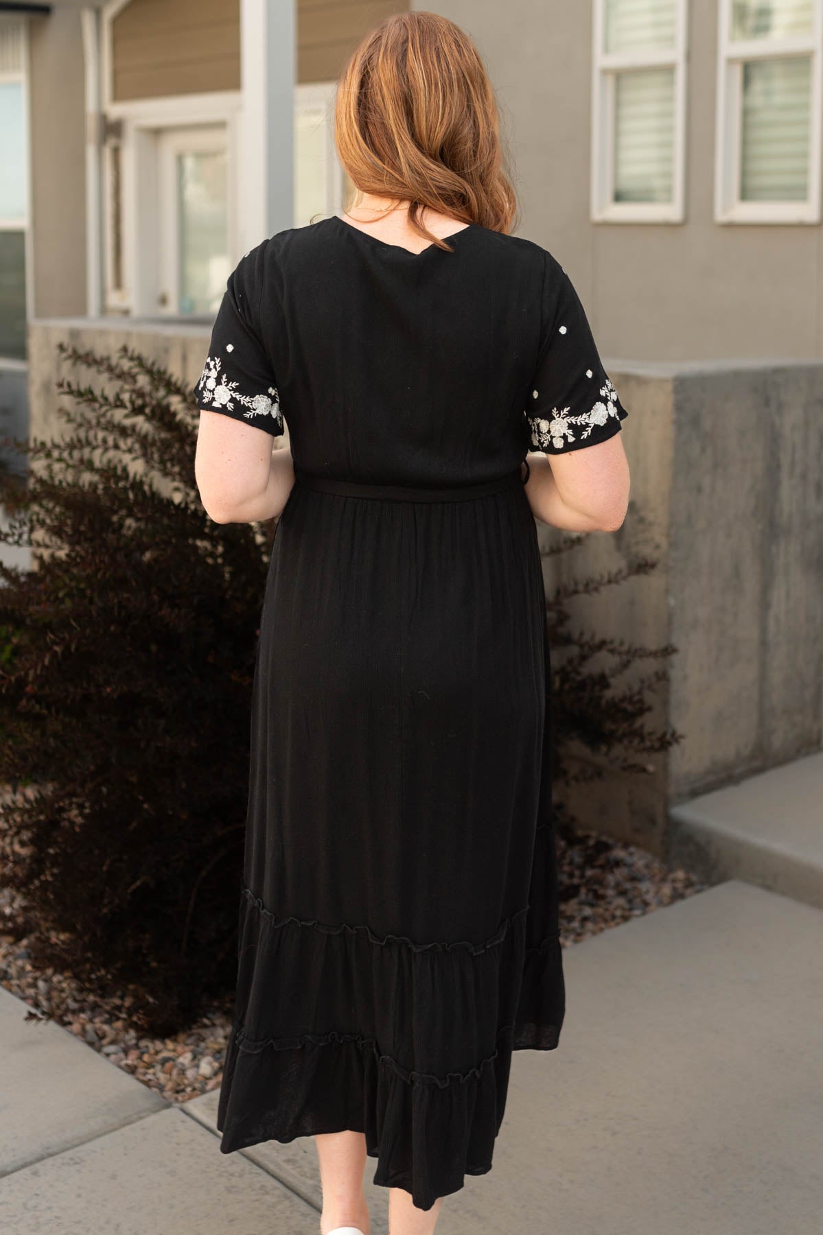 Back view of a black floral dress