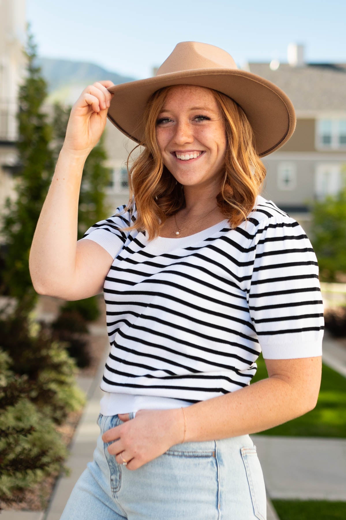 Ivory striped top with black stripes and ivory cuffs