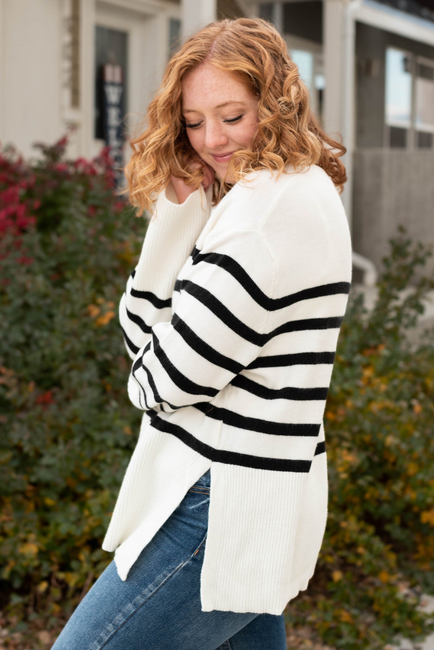 Side view of a striped sweater