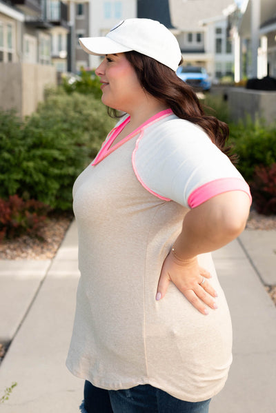 Side view of the plus size taupe pink color block top