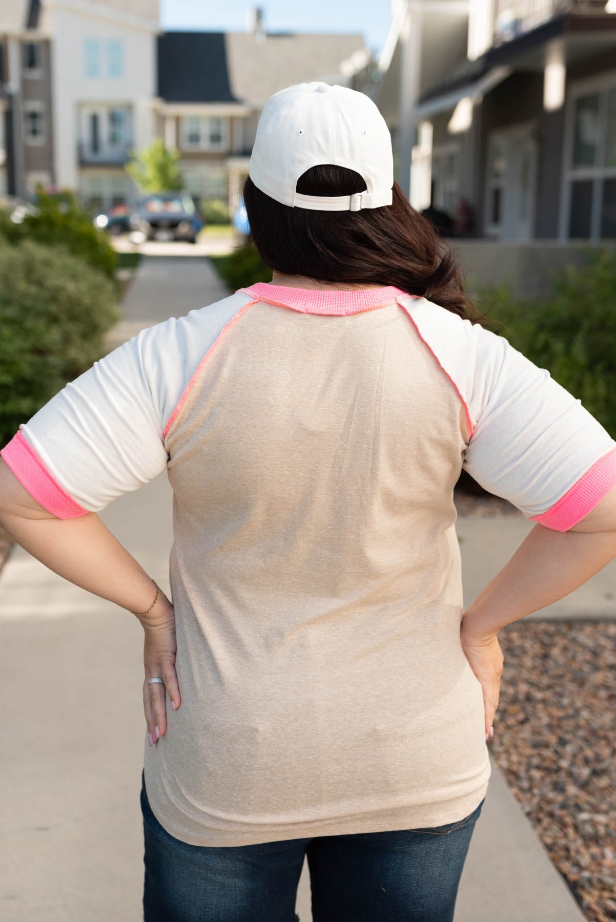 Back view of the plus size taupe pink color block top