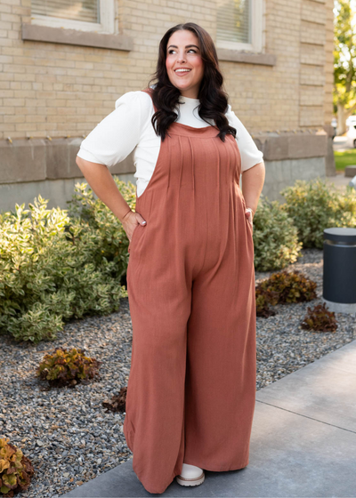 Plus size rust wide leg overalls with pockets