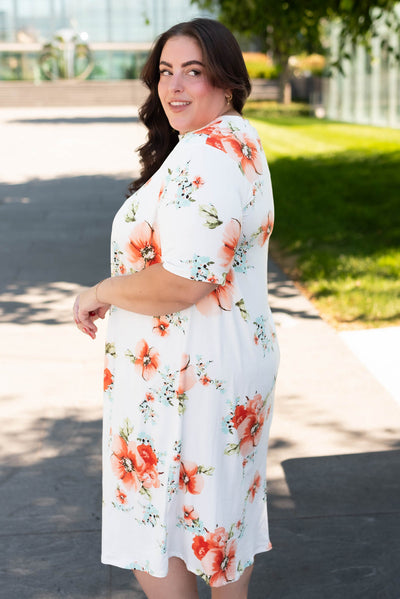 Side view of the plus size ivory floral midi dress