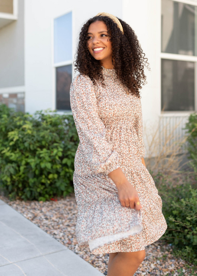 Long sleeve beige floral smocked dress