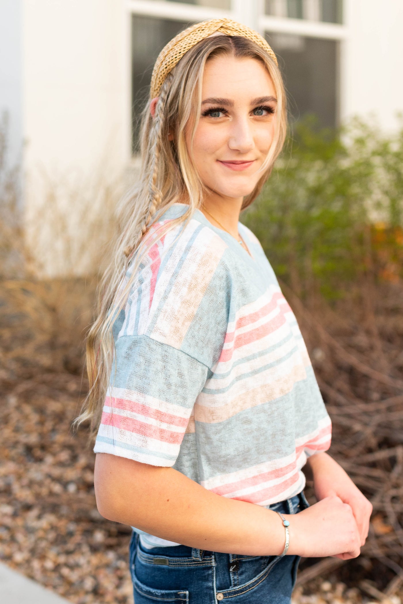 Side view of the v-neck stripe shirt