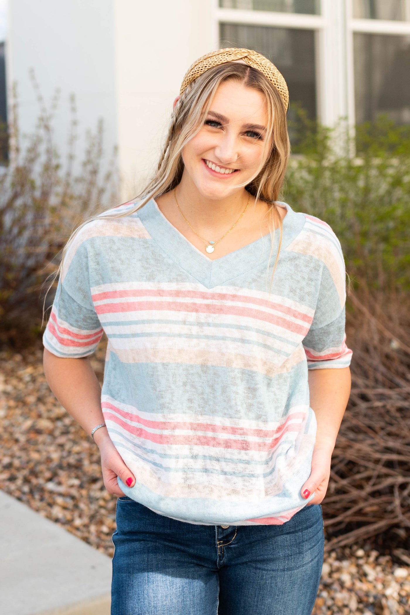 Blue v-neck stripe shirt with pink and peach