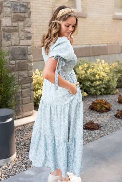 Side view of the sage floral smocked dress