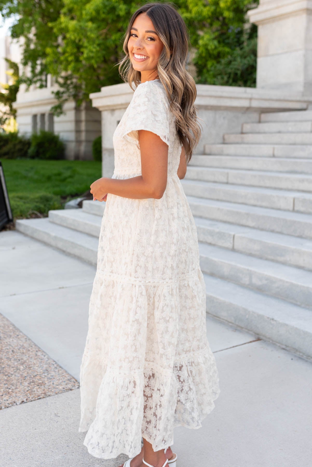 Side view of the cream floral lace dress