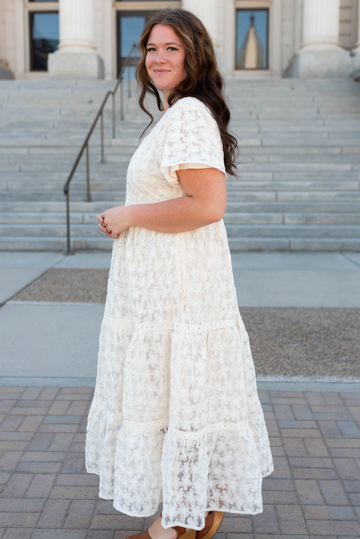 Side view of the cream floral lace dress