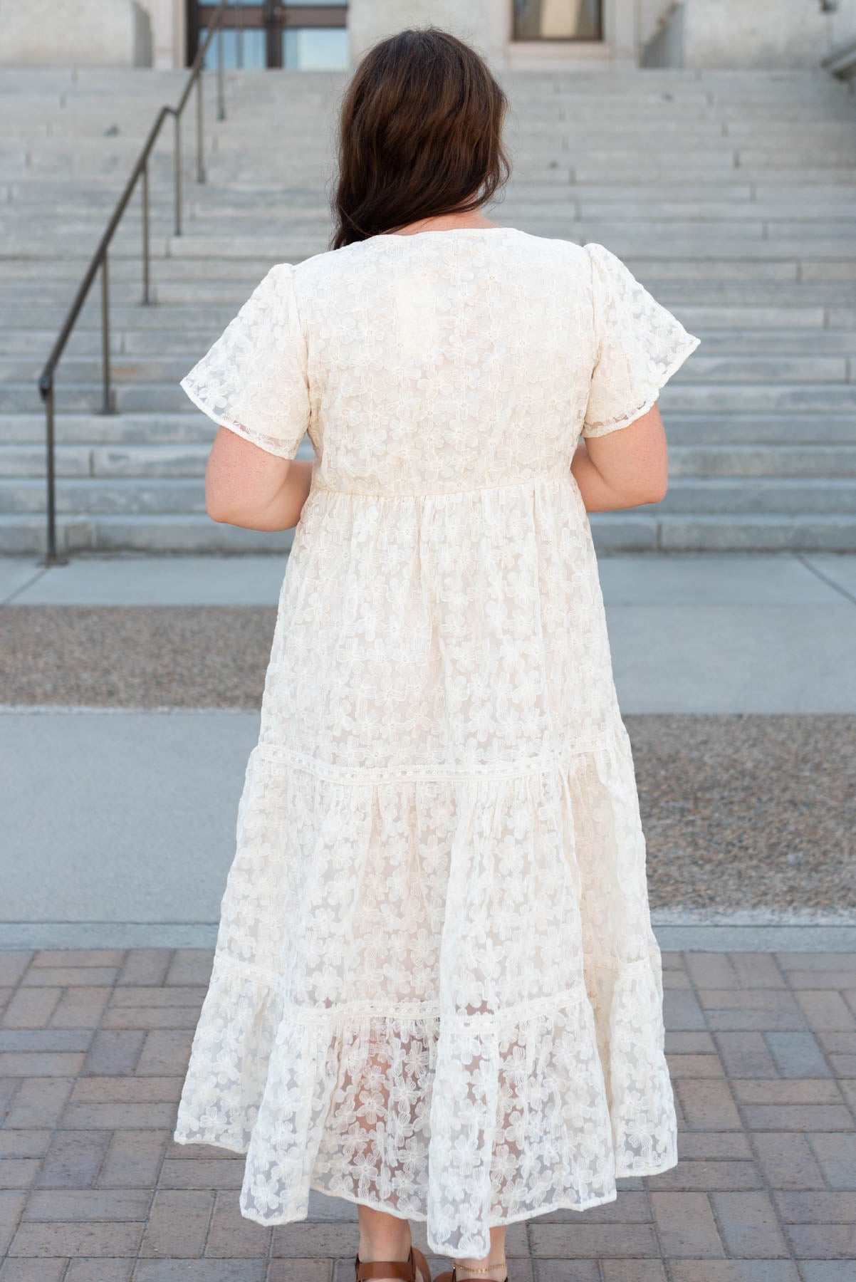 Back view of the plus size cream floral lace dress